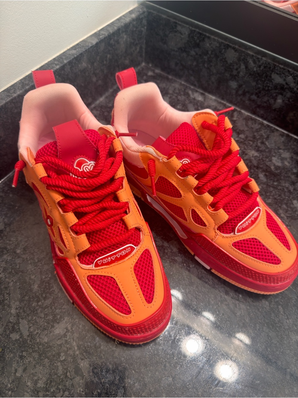 LV skates red and orange